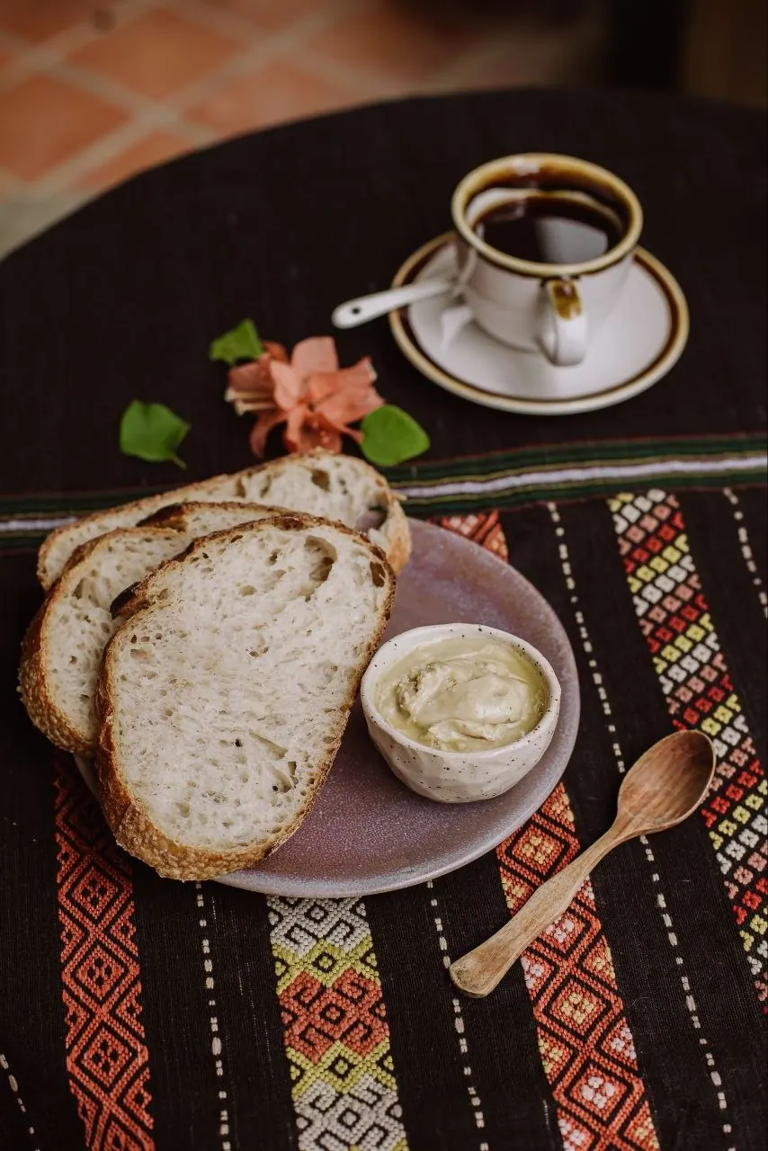 Turkish coffee with sourdough slices and a dab of butter