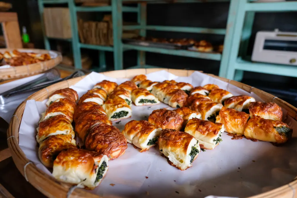 Spinach pastries in a woven basket